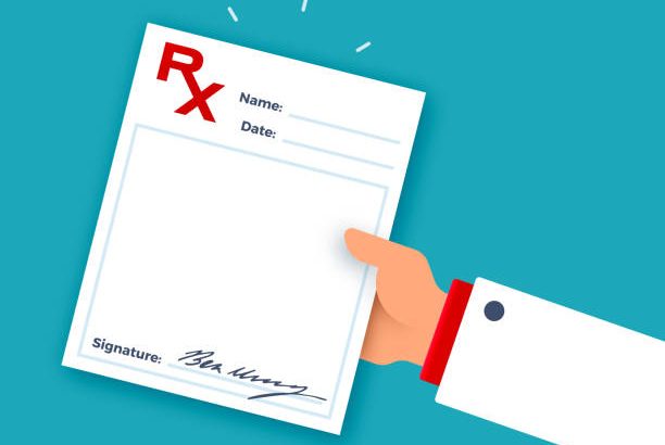 Doctor's hand giving medical prescription.